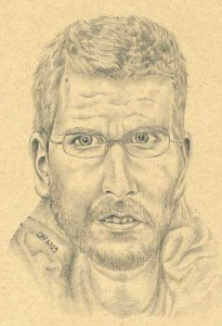man in glasses drawing